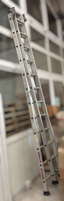 a ladder that is leaning against a wall in a room
