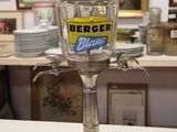 a silver cup that is sitting on top of a counter