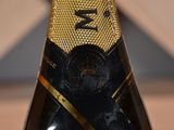 a close up of a bottle of champagne on a table