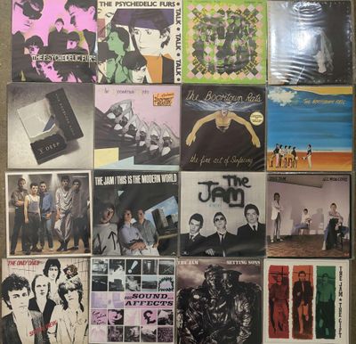 the beatles album covers are displayed on a wall in a room