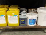 a cart with a lot of yellow and white containers on it