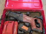 a red tool box with tools in it on the floor