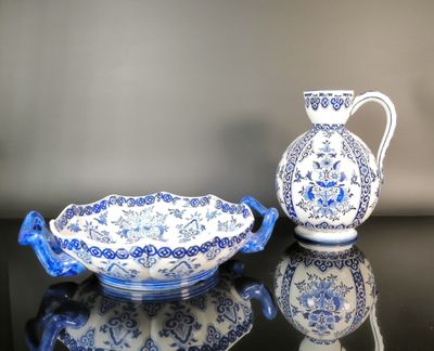a blue and white vase and a bowl on a table