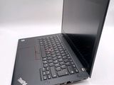a laptop with a black keyboard on a white surface