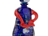 an image of a blue glass bottle with a red handle