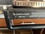 a close up of a black and white mixer on a table
