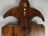 clock made of wood with a wooden cross on the face