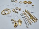many different types of jewelry on display on the table