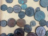 a close up of a box filled with lots of different types of coins