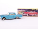 toy car and box of disney cars on a white surface