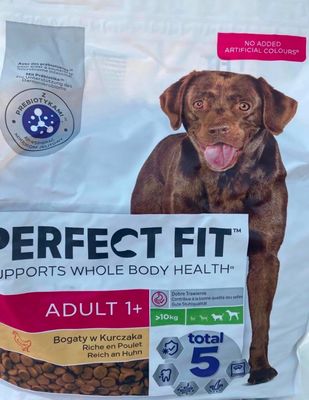 a bag of perfect fit dog food with a dog ' s face