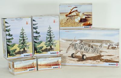 four boxes of model airplanes sitting on a table