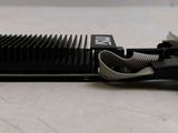 an image of a close up of a metal device on a table