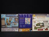 three nintendo wii games on the black table