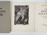 three books sitting on top of a white table next to each other