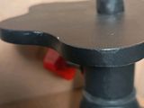 a close up picture of a tripod with a camera on it