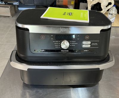 a black and silver oven sitting on top of a counter