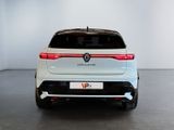 the rear end of a white volkswagen suv parked in a room
