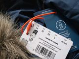 a tag that says made in china attached to a jacket
