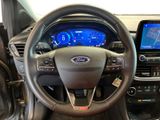 the interior of a car with a steering wheel, dashboard, and display screen