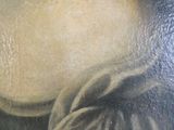 a painting of a woman ' s face with long hair