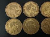 four gold sovereigns, one of which is a sovereign and the other of which is a sovereign