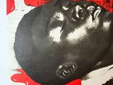 an image of a poster with a man ' s face in the middle of it
