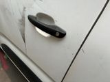 a close up of a door handle on a white car