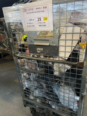 a large metal cage with a lot of items in it