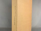 an open cardboard box sitting on top of a gray surface