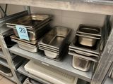 many trays of food on the shelves in the kitchen