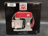 packaging of a kenwood mixer in a box on a table
