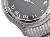 an image of a close up of a wrist watch with roman numerals