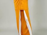 a mannequin wearing an orange skirt and white shirt