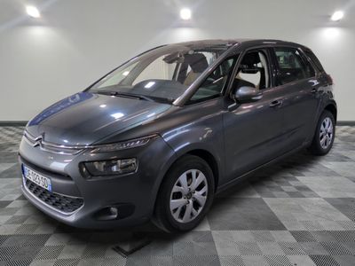 the grey citrole is parked in the garage on a checkered floor