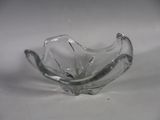 a glass bowl that is sitting on a table