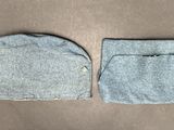two pieces of clothing are laying out on a table