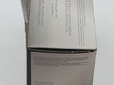 a box with a piece of paper sticking out of it