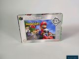 une image représentant une boîte de jeu Nintendo sur laquelle figure un Mario Kart