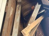 a pile of wood and other items in a bin