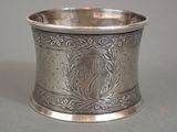 a silver cup with a horse on it on a table