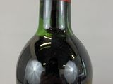 a bottle of wine that is sitting on a table