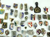many different types of badges on a white surface
