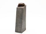 statue of a cat sitting on top of a cement block