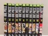 six anime dvds are stacked on top of each other on a table