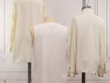 three mannequins with white shirts on display in front of a white wall