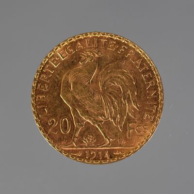 a gold coin with a picture of a rooster on it