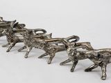 silver plated figurine of a herd of horses pulling a wagon