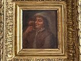 painting of a woman drinking a glass of wine in a gold frame