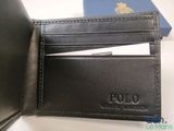 a black leather wallet with a credit card in it